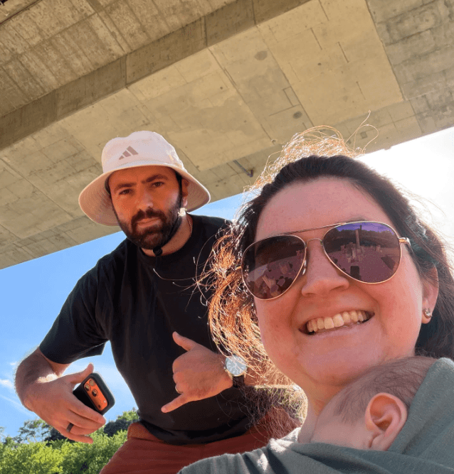 Zakk and his wife enjoying a sunny outing with their baby